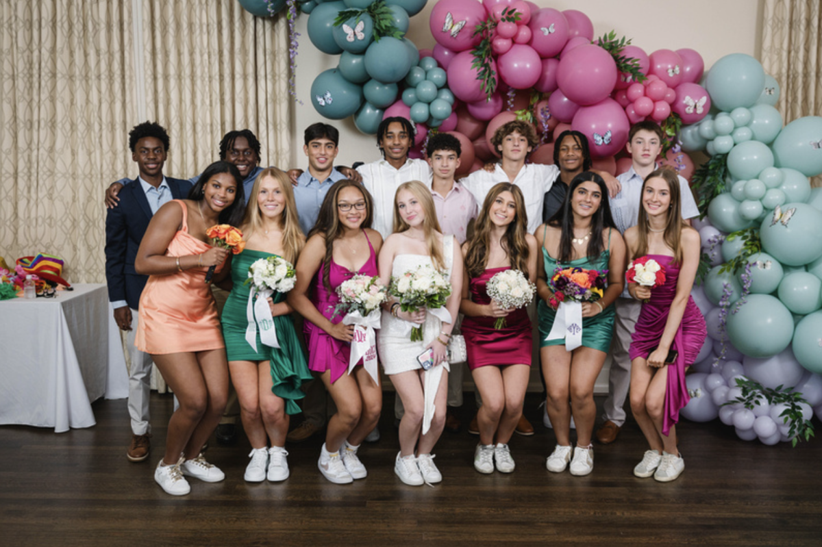 A group of freshmen pose for a picture at the dinner.